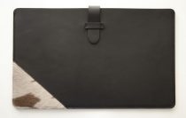 Leather laptop case decorated with fur